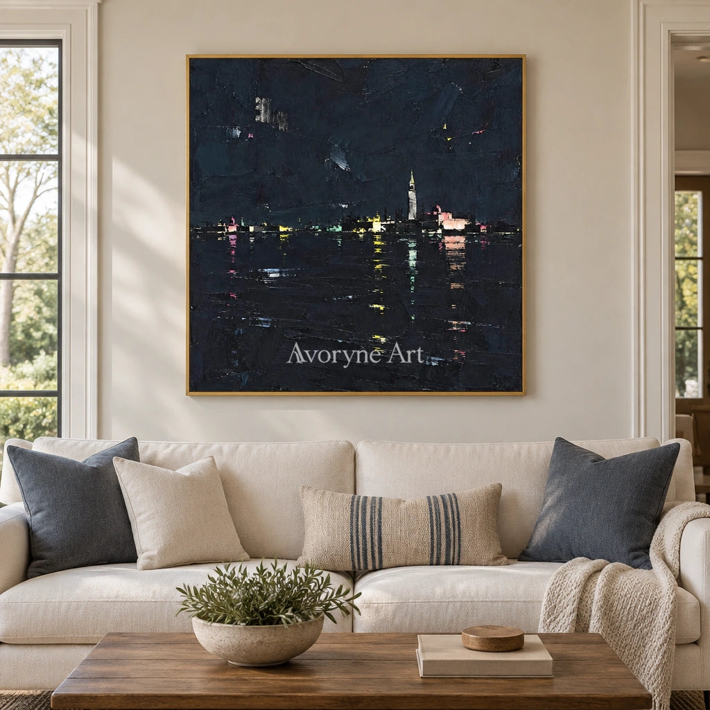 Still Trace cityscape wall art with a gold frame hanging in a living room