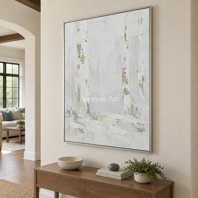 Tender Rhythm cityscape wall art with a silver frame in an entryway