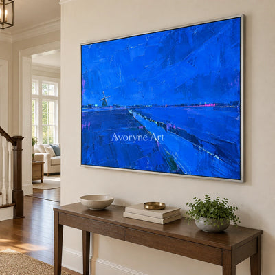 Tender Verse cityscape wall art with a silver frame in an entryway