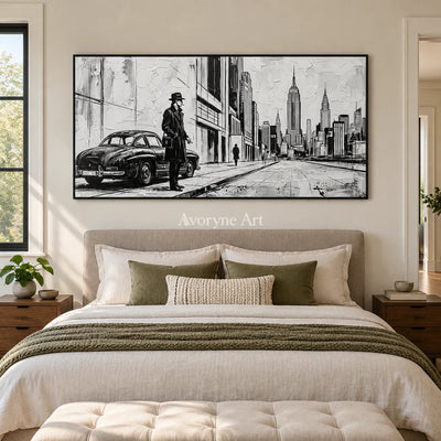 Silver Reverie cityscape wall art with a black frame above a bed in a bedroom