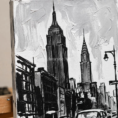 Close-up of the hand-painted texture of Silver Echo cityscape wall art on an easel