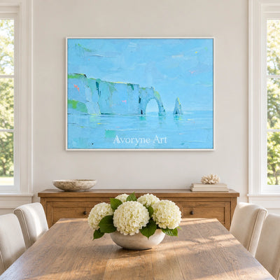 Tender Drift coastal landscape wall art with a white frame in a dining room