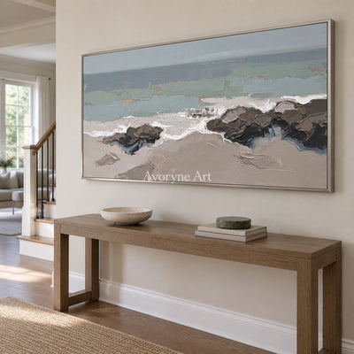 Restful Echo coastal landscape wall art with a silver frame in an entryway