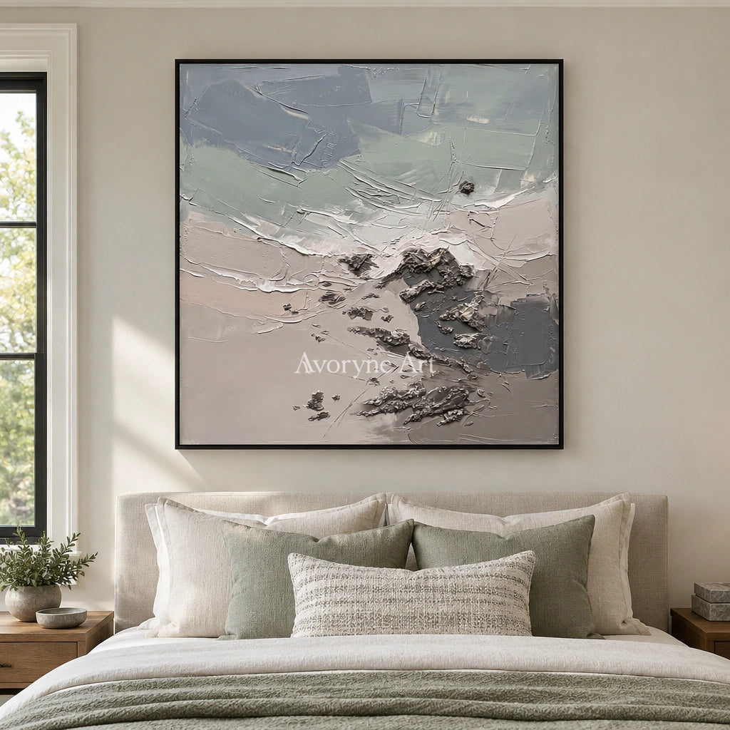 Restful Gesture coastal landscape wall art with a black frame above a bed in a bedroom