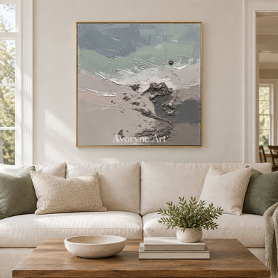 Restful Gesture coastal landscape wall art with a gold frame hanging in a living room