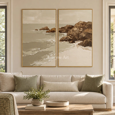 Restful Interval coastal landscape diptych with a gold frame hanging in a living room