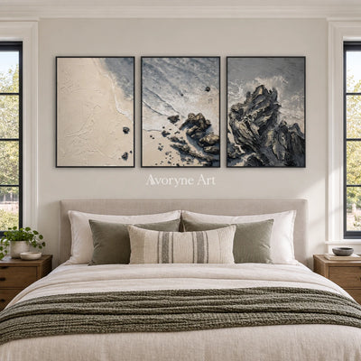 Restful Mosaic coastal landscape triptych with a black frame above a bed in a bedroom