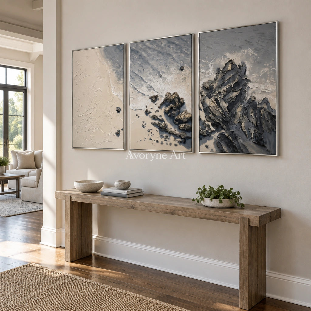 Restful Mosaic coastal landscape triptych with a silver frame in an entryway