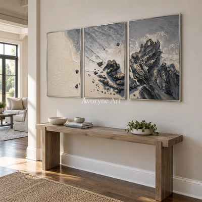 Restful Mosaic coastal landscape triptych with a silver frame in an entryway