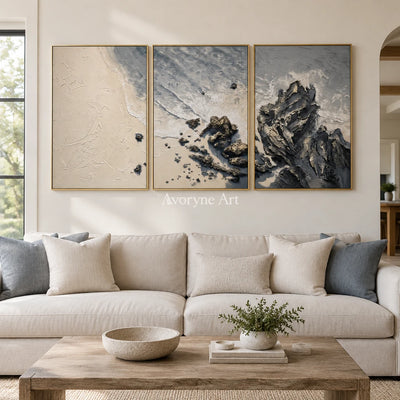 Restful Mosaic coastal landscape triptych with a gold frame hanging in a living room
