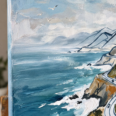 Close-up of the hand-painted texture of Silver Mosaic coastal road wall art on an easel