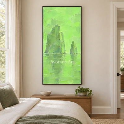 Still Reverie color block landscape wall art with a black frame above a bed in a bedroom