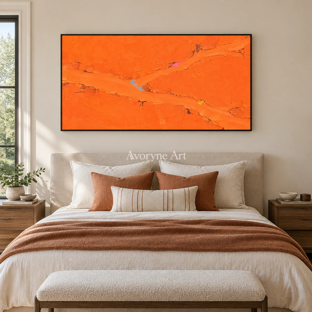 Still Echo color block landscape wall art with a black frame above a bed in a bedroom