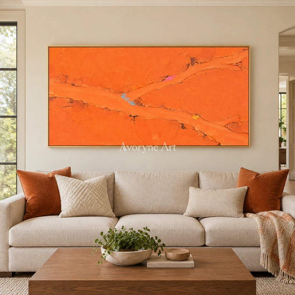 Still Echo color block landscape wall art with a gold frame hanging in a living room