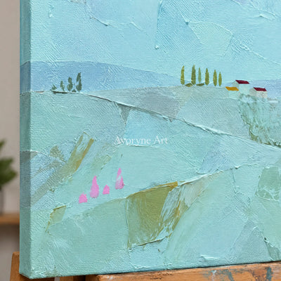 Close-up of the hand-painted texture of Still Story color block landscape wall art on an easel
