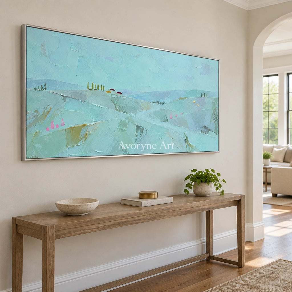 Still Story color block landscape wall art with a silver frame in an entryway