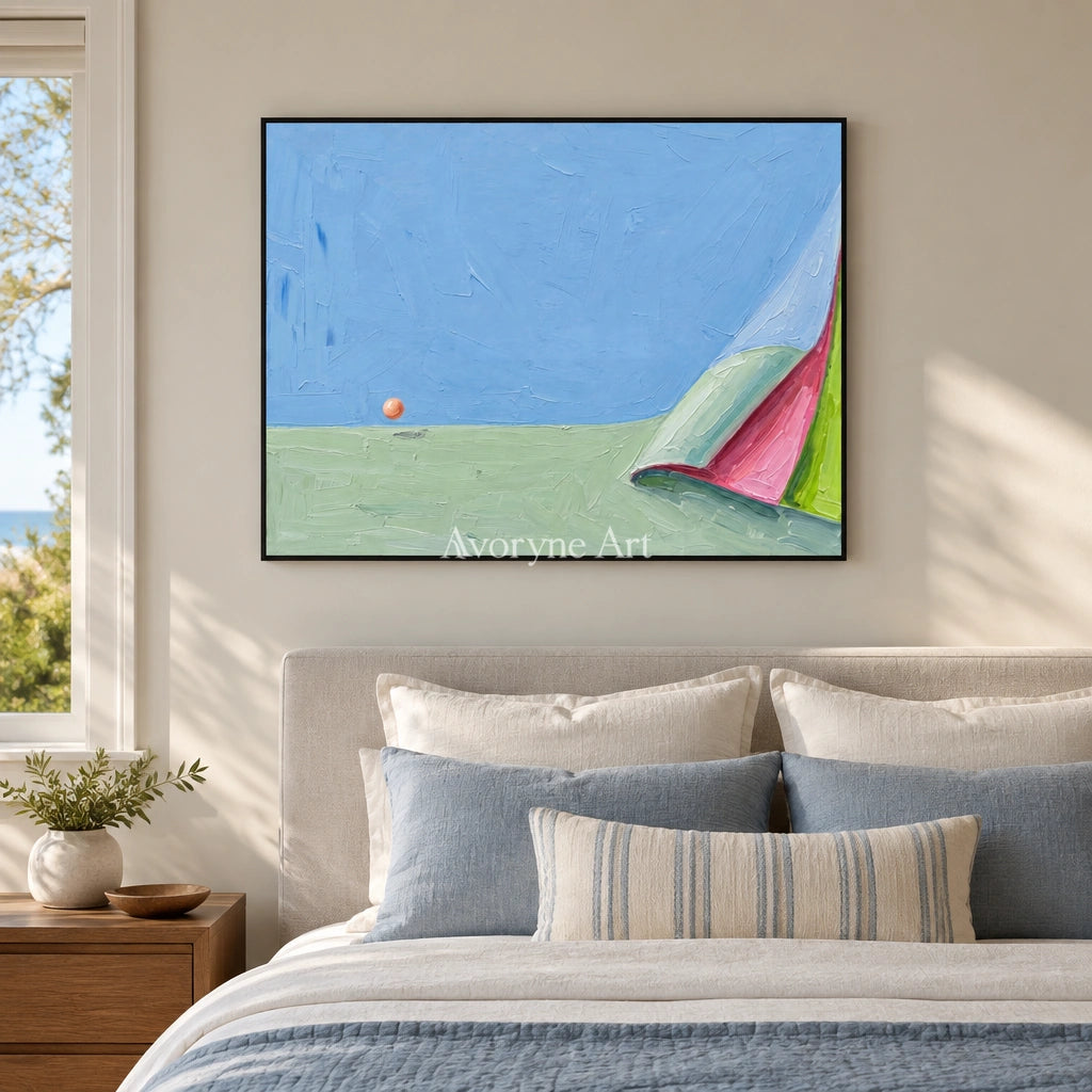 Still Vista color block landscape wall art with a black frame above a bed in a bedroom