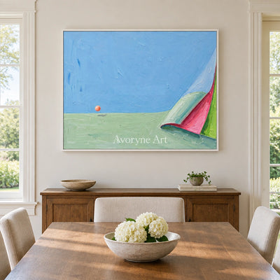Still Vista color block landscape wall art with a white frame in a dining room