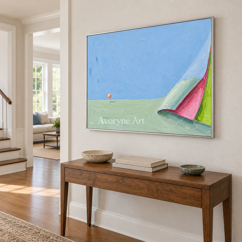 Still Vista color block landscape wall art with a silver frame in an entryway