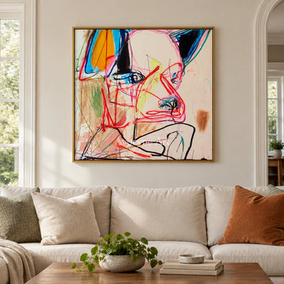 Restful Cadence colorful figure wall art with a gold frame hanging in a living room