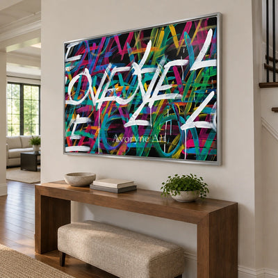 Hidden Verse colorful love wall art with a silver frame in an entryway
