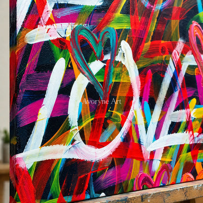 Close-up of the hand-painted texture of Hidden Memory colorful love wall art on an easel