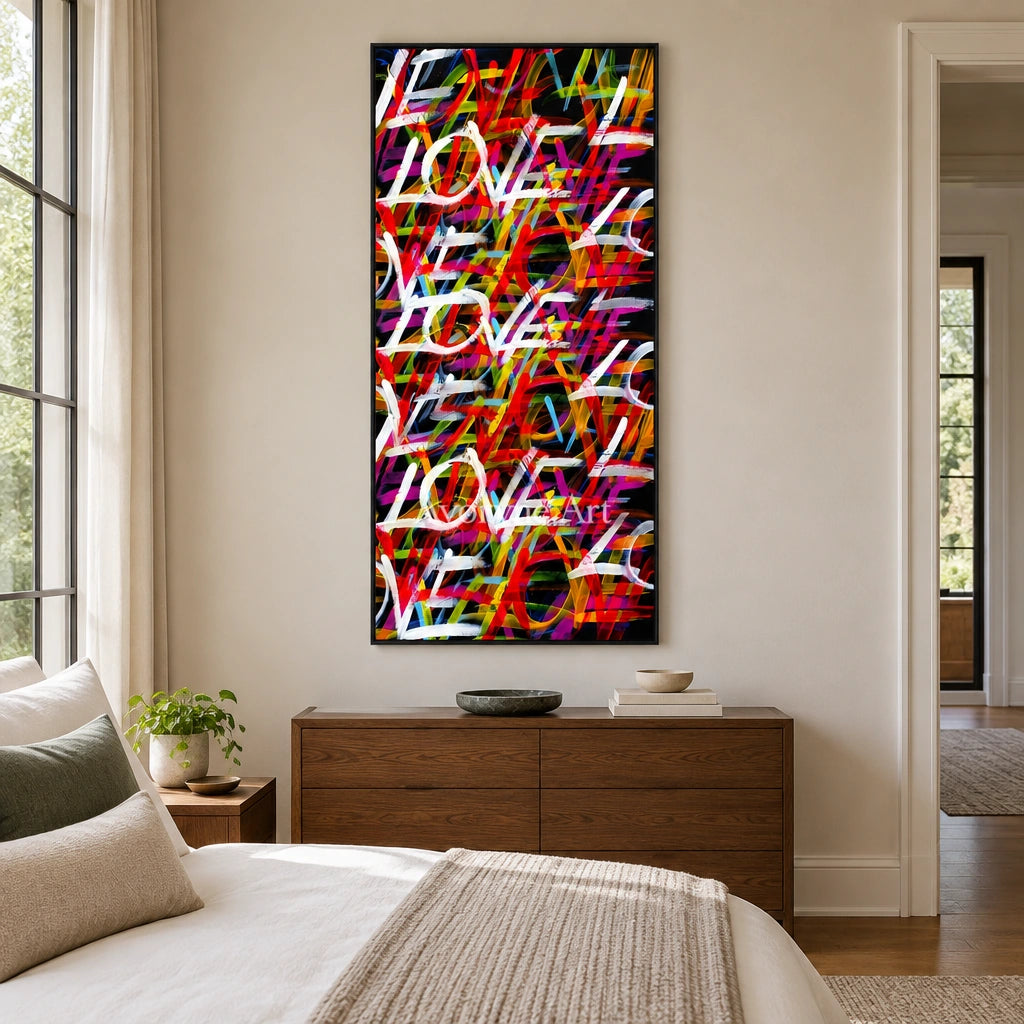 Hidden Story colorful love wall art with a black frame above a bed in a bedroom