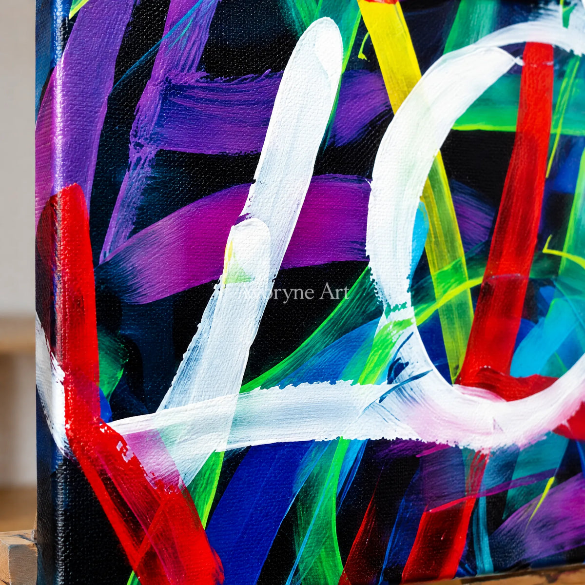 Close-up of the hand-painted texture of Hidden Trace colorful love diptych on an easel