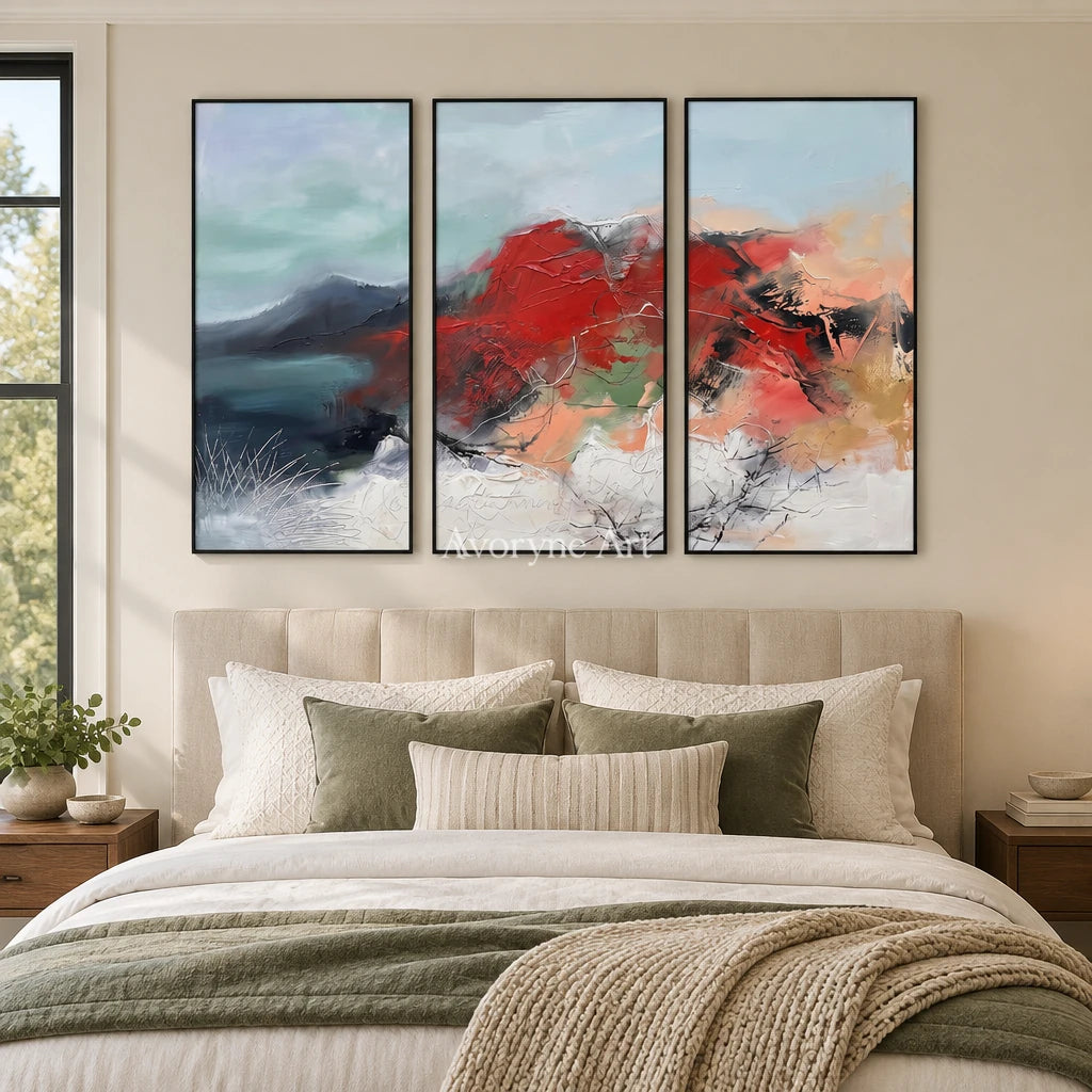 Blue Solace colorful mountain triptych with a black frame above a bed in a bedroom