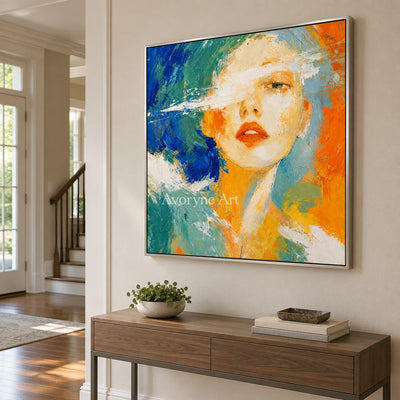 Silver Story colorful portrait wall art with a silver frame in an entryway