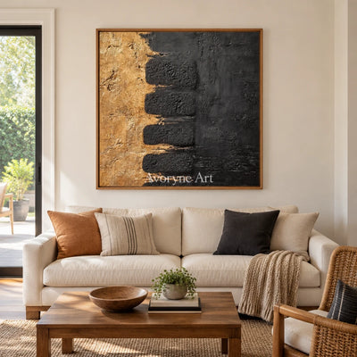 Quiet Measure dark mineral relief wall art with a wood frame in a villa living space