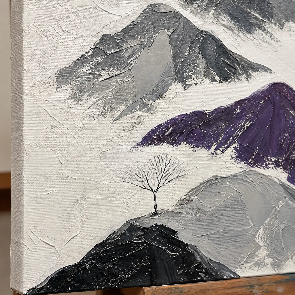 Close-up of the hand-painted texture of Misted Echo dark mountain relief wall art on an easel
