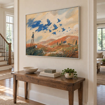 Blue Gesture dreamlike scene wall art with a silver frame in an entryway