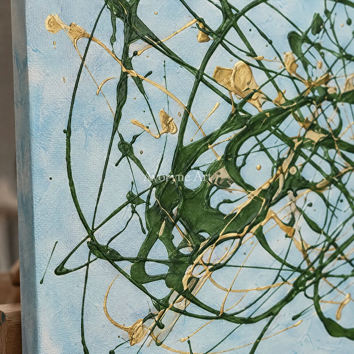 Close-up of the hand-painted texture of Golden Rhythm drip abstract diptych on an easel