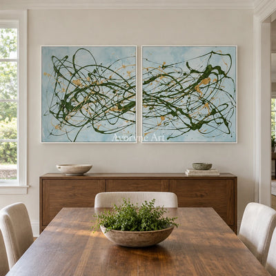 Golden Rhythm drip abstract diptych with a white frame in a dining room