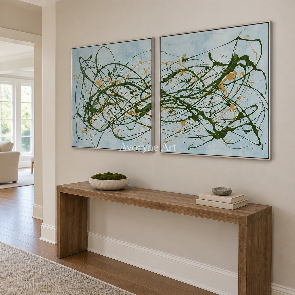 Golden Rhythm drip abstract diptych with a silver frame in an entryway