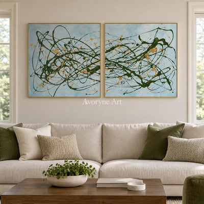 Golden Rhythm drip abstract diptych with a gold frame hanging in a living room