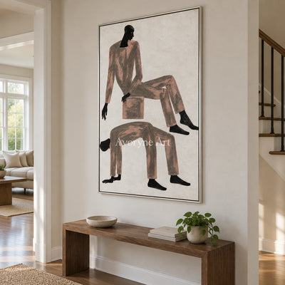 Lucent Mosaic dynamic figure wall art with a silver frame in an entryway