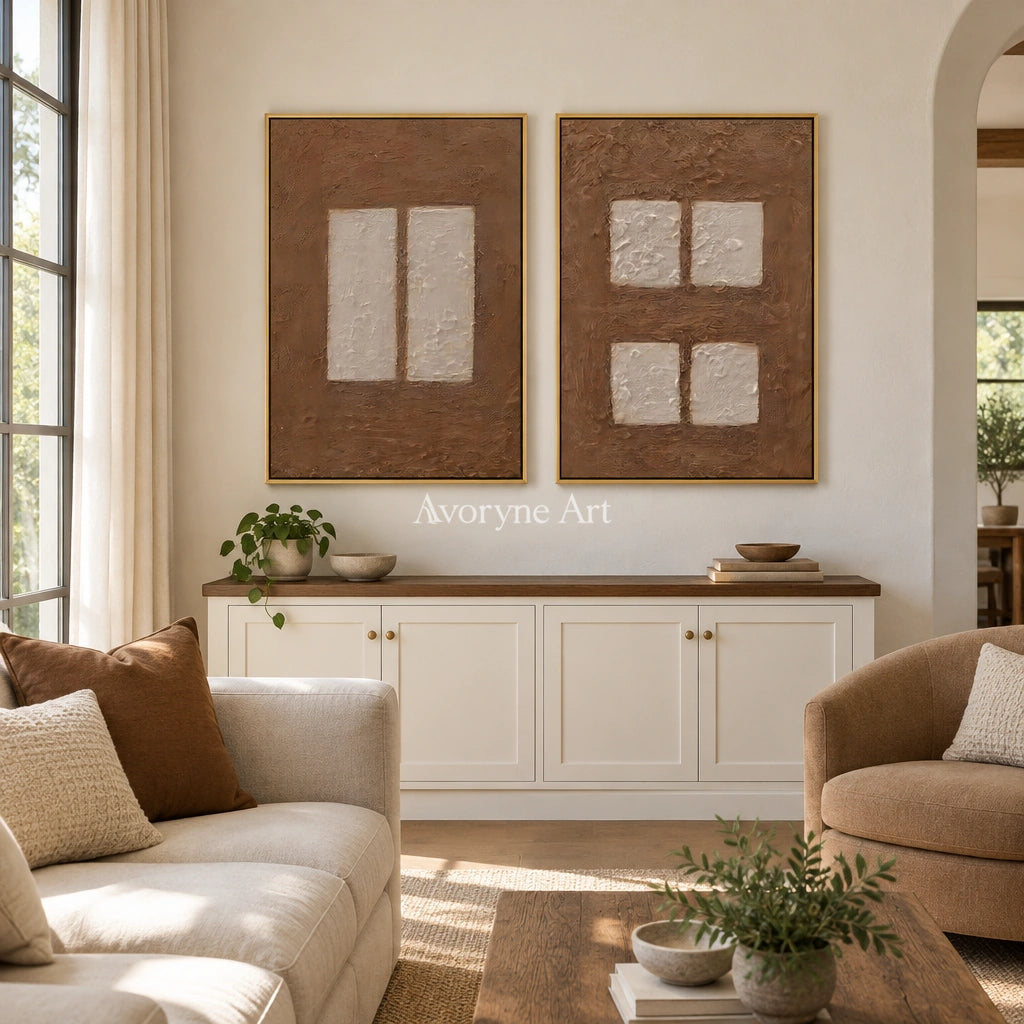 Warm Refrain earth block relief diptych with a gold frame hanging in a living room