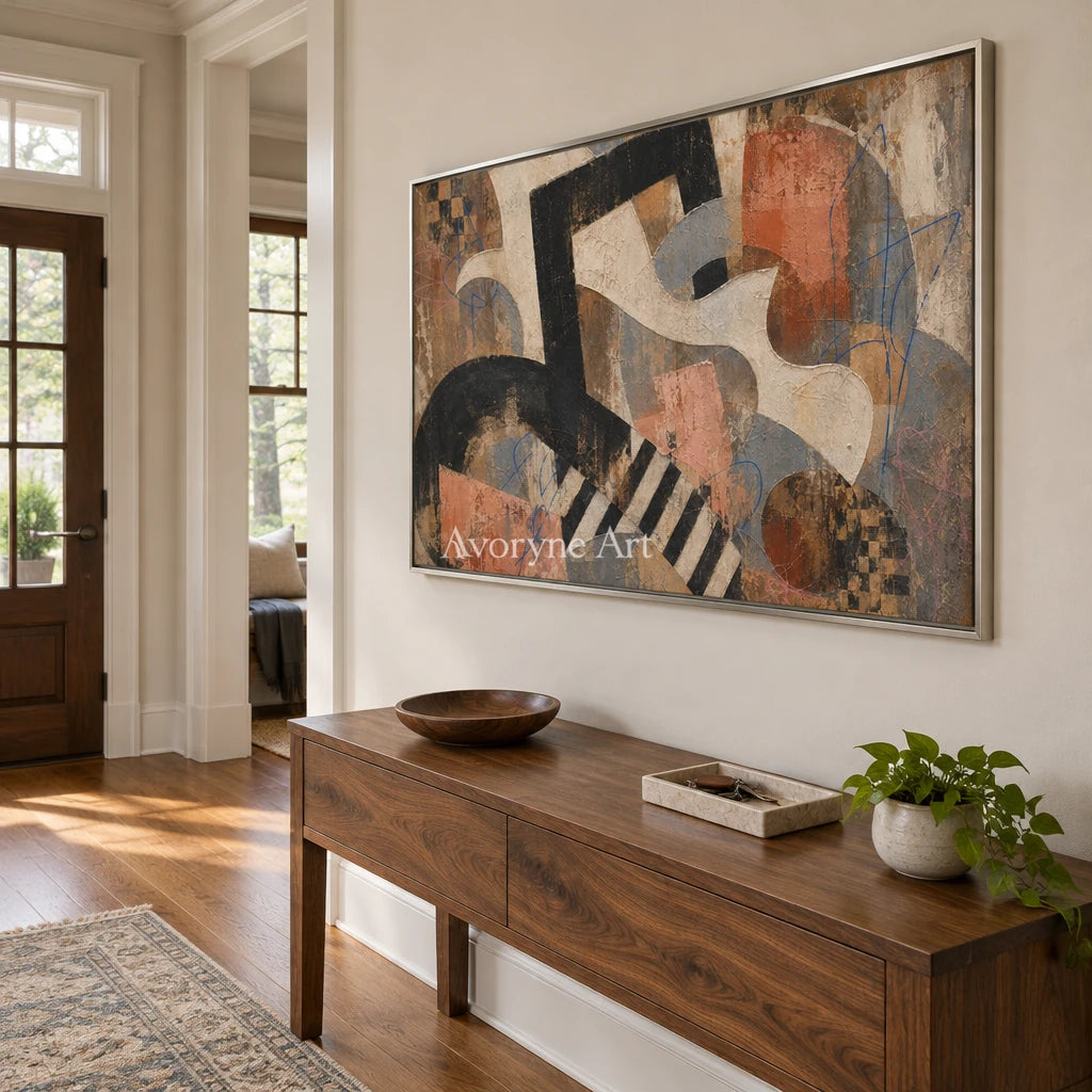 Woven Drift earth geometric art with a silver frame in an entryway