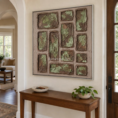 Misted Sonata earth grid relief wall art with a silver frame in an entryway