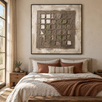 Weathered Horizon earth grid relief wall art with a black frame above a bed in a bedroom