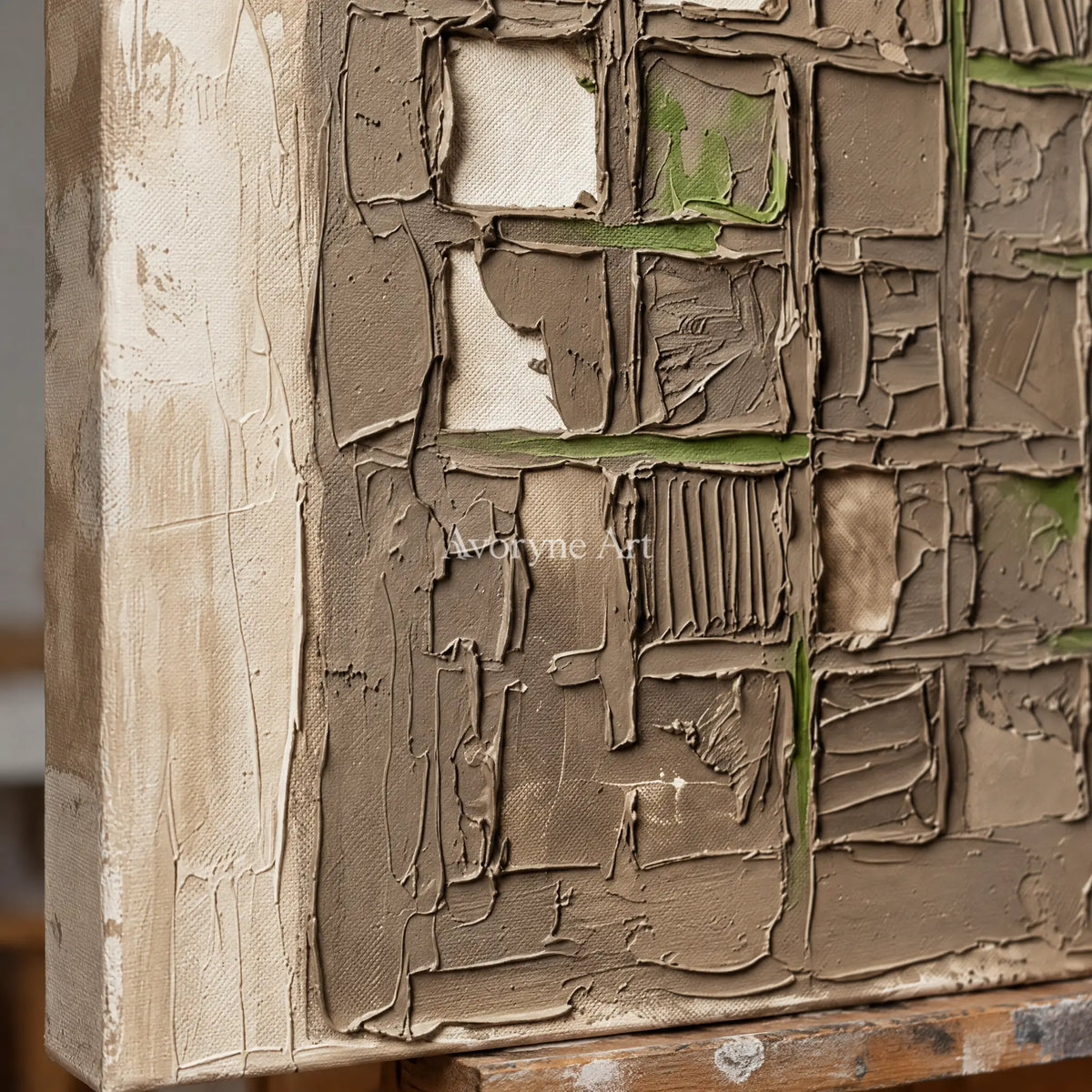 Close-up of the hand-painted texture of Weathered Horizon earth grid relief wall art on an easel