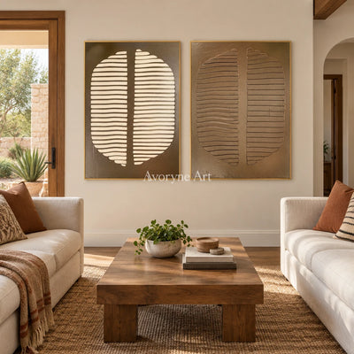 Muted Measure earth grooved curves diptych with a gold frame hanging in a living room