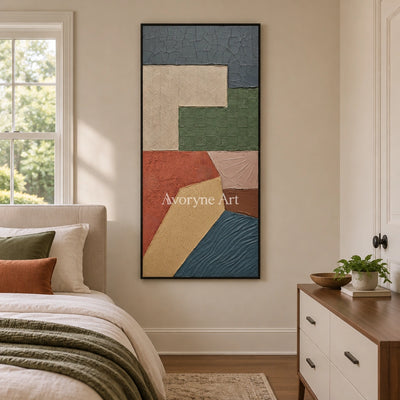Mineral Current earth patch texture wall art with a black frame above a bed in a bedroom