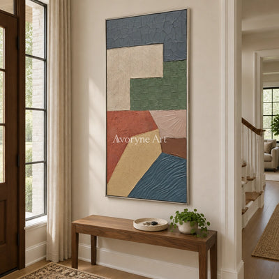 Mineral Current earth patch texture wall art with a silver frame in an entryway