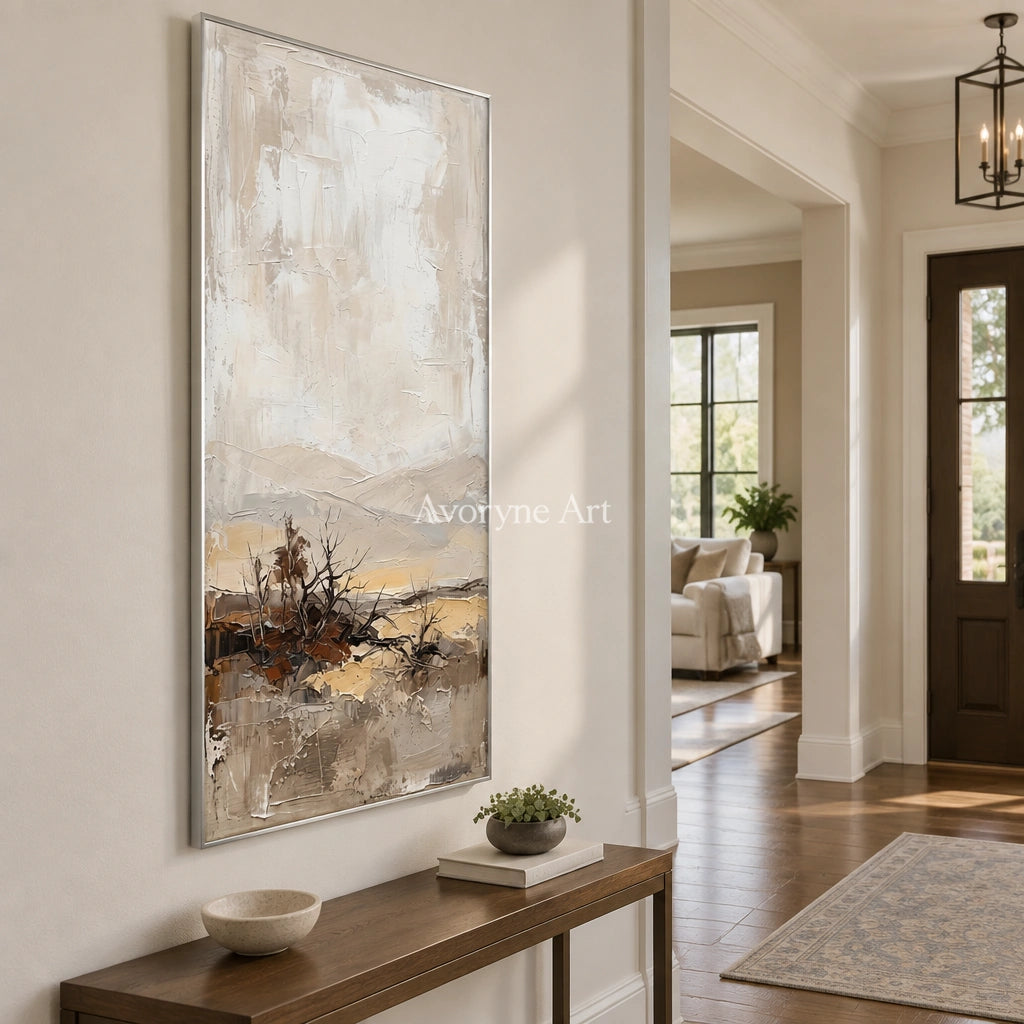 Bright Verse earth tone landscape wall art with a silver frame in an entryway