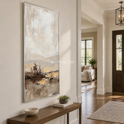 Bright Verse earth tone landscape wall art with a silver frame in an entryway