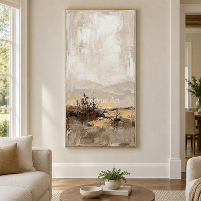 Bright Verse earth tone landscape wall art with a gold frame hanging in a living room