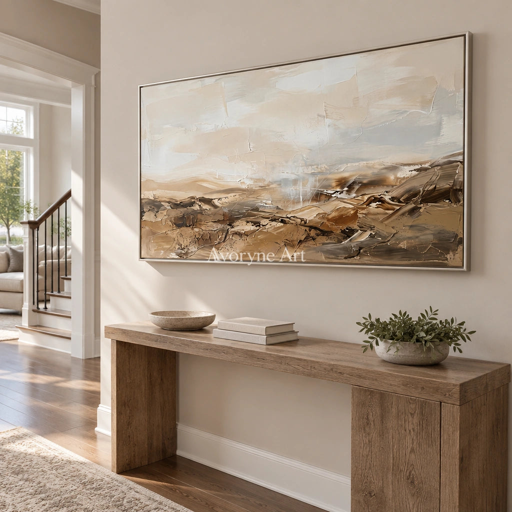 Bright Story earth tone landscape wall art with a silver frame in an entryway